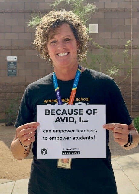 Renee Kory holding a sign that says "Because of AVID, I... can empower teachers to empower students!"